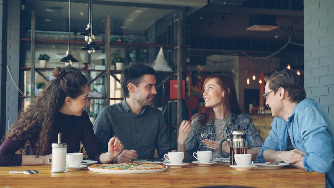 Small group of colleagues discussing at a table